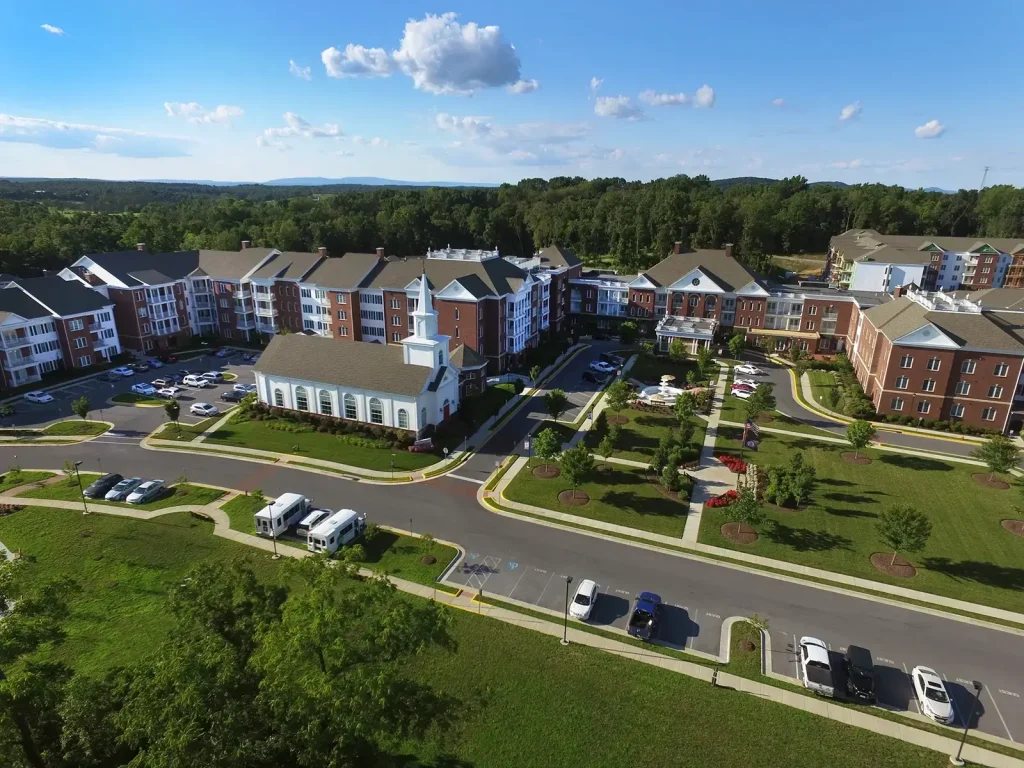 Aerial photography of building complex, church, and parking lot
